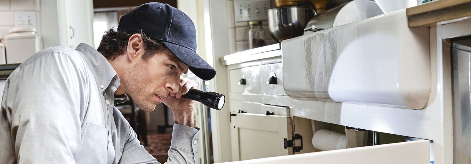 Technician inspecting a home for rodents